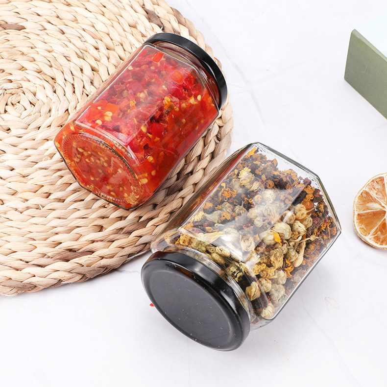 Botella de vidrio hexagonal espesada botella de miel sellada con tapa de crema de limón enlatado de salsa de Chile botella fábrica al por mayor