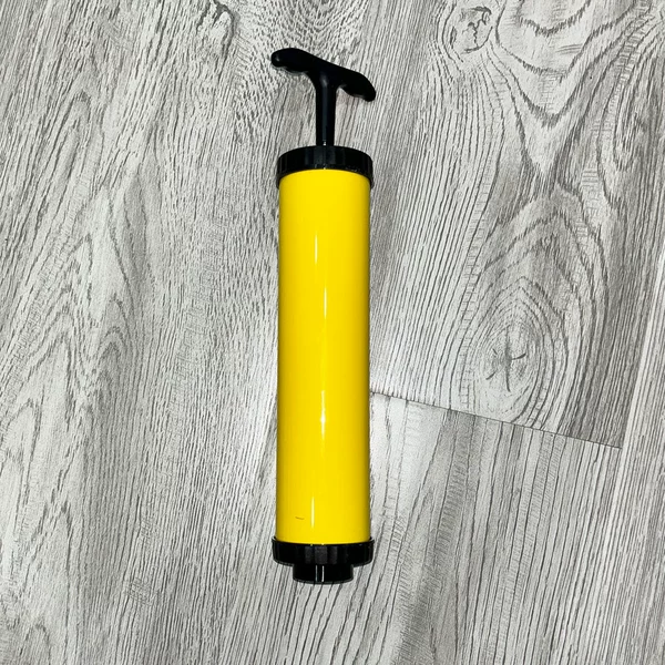Yellow hand pump
