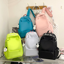 新款森系纯色防水双肩包时尚简约大容量初高中大学生少女耐用书包