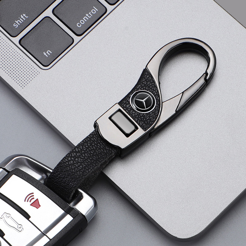 Llavero de automóvil transfronterizo, logotipo del automóvil, cientos de apellidos, botones de cuero de alta gama, colgante de llavero de negocios simple y personalizado