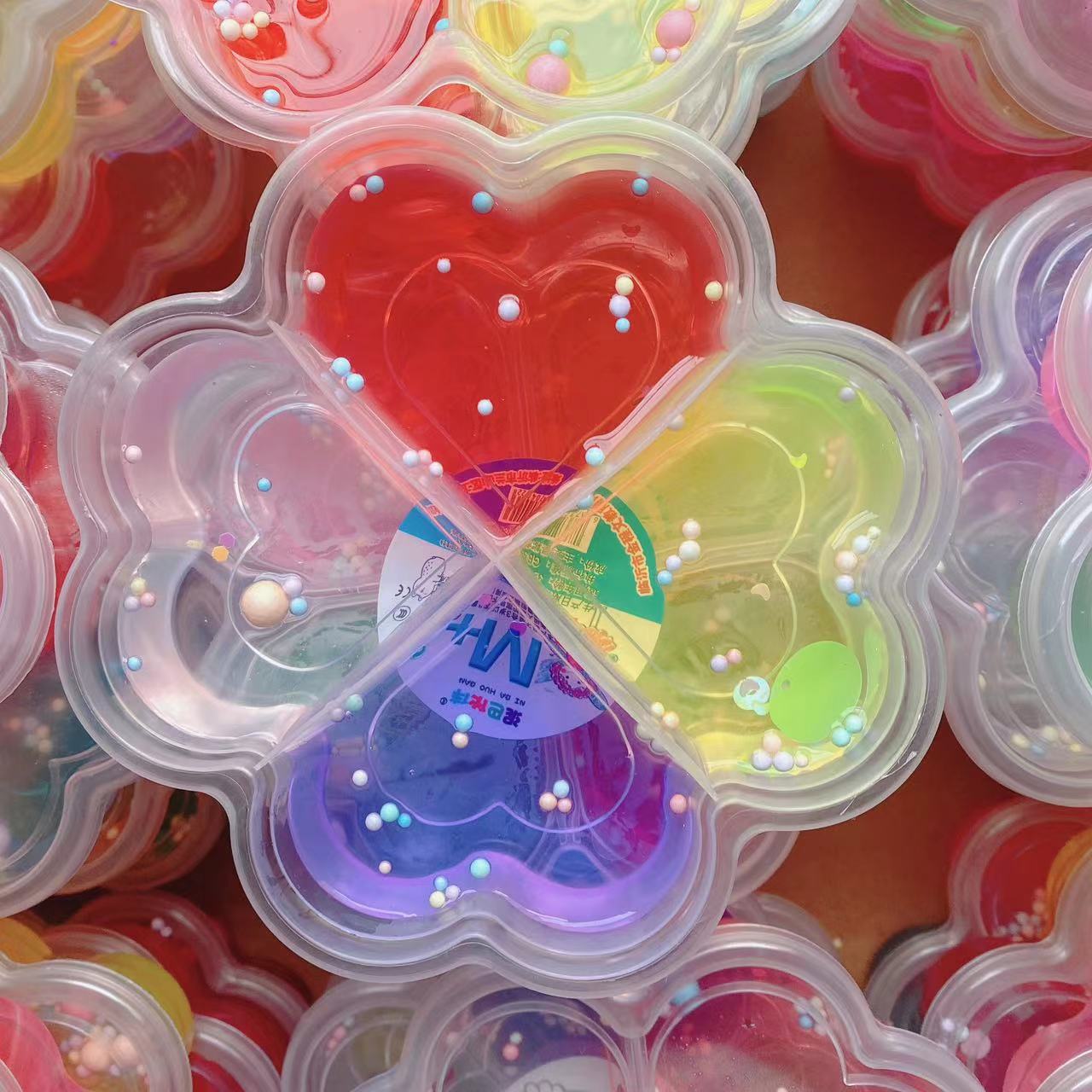 Barro de cristal de cuatro hojas de barro de cristal de ciencia y educación goma espumante slime 4 colores para niños diy alta transparencia 4 cuadros 2 yuanes lotes de departamentos