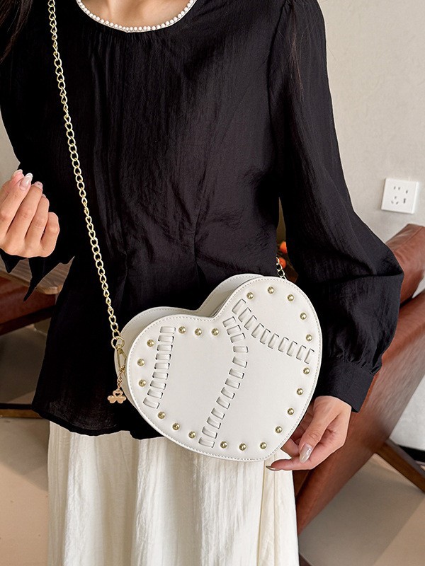 Bolso de mujer verano nuevo bolso en forma de corazón nicho coreano diseño de moda trenzado remaches cadena mochila de hombro
