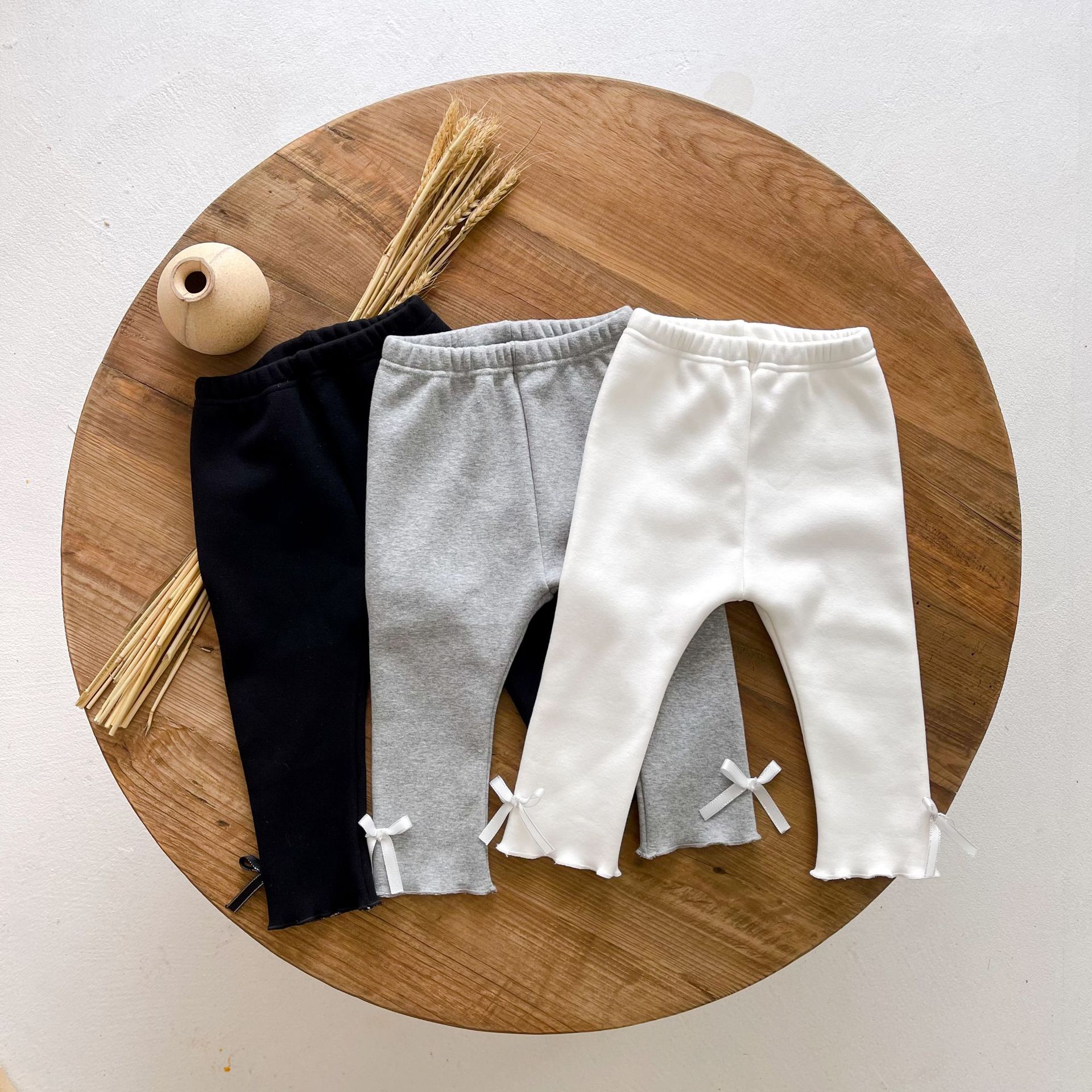 Las polainas de las muchachas invierno estilo coreano color sólido bowknot Bebé Pantalones casuales espesado cálido bebé niñas polainas de algodón