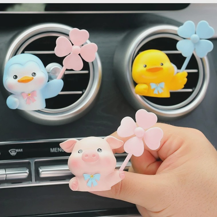 Aire acondicionado del automóvil salidas de aire decoraciones aromáticas dibujos animados lindo cerdo coche eléctrico consola adornos de perfume montados en el automóvil