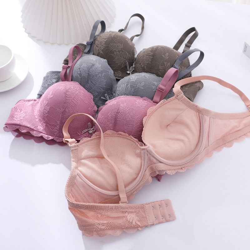 Fábrica de stock pequeño pecho grueso sujetador sexy encaje reunido ropa interior de mujer con anillo de acero sobre el bra de caída