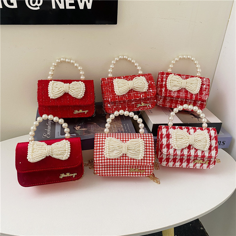 Mochila de niños estilo extranjero princesa perla de viento pequeño cambio bolso de hombro de niña encantadora