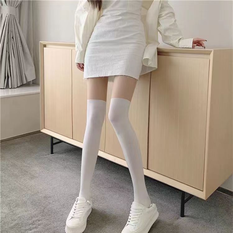 偽の高筒は黒のストッキングの女性の薄い金の偽の太ももをつなぎ合わせて膝の靴下のセクシーなかわいい底を打ってズボンの靴下のjkネットの赤をつなぎます。