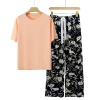 Orange pink + white flowers on black background