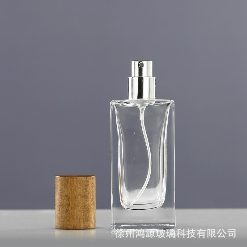 Perfume al por mayor botella de vidrio 30ml50ml botella de bayoneta cuadrada vintage Lotus cubierta de madera aerosol fino sub-botella portátil
