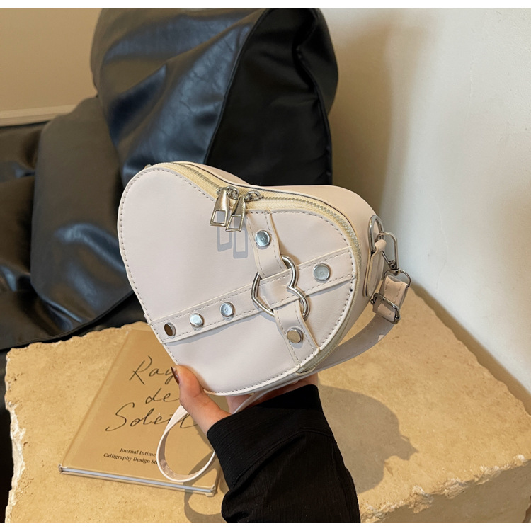 Internet celebridad personalizada de moda del todo-fósforo de color sólido en forma de corazón bolsa de costura bolsa de las mujeres nicho diseño crossbody hombro bolsa de las axilas