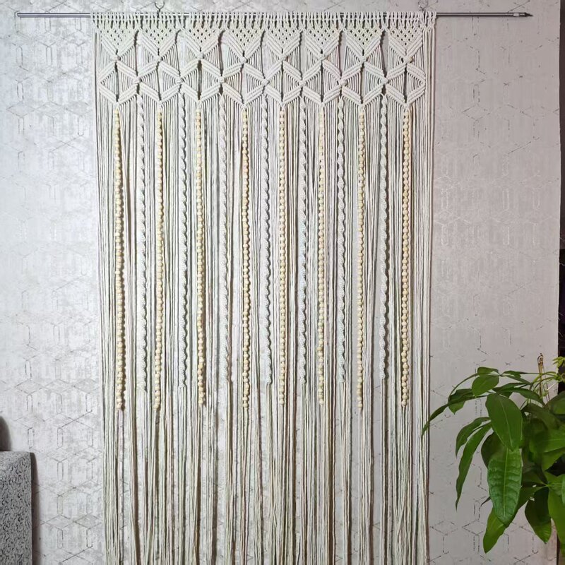 Finished woven tapestry with wooden beads, used as a door curtain, room divider, or bohemian-style tapestry for wedding decorations and photo props
