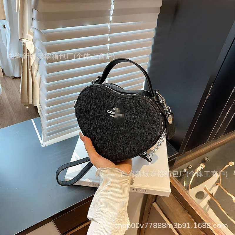 Bolso de mano en forma de corazón de comercio exterior, bolso de hombro de impresión de moda creativa, bolso de hombro simple, bolso de hombro de dama de Europa y América.