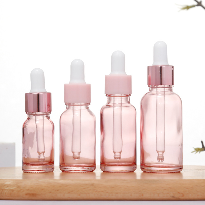 Botella de aceite esencial de color rosa transparente Esencia de líquido sub-botella gotero de vidrio Aceite de Masaje puro Rocío líquido sub-envasado de vidrio botella vacía
