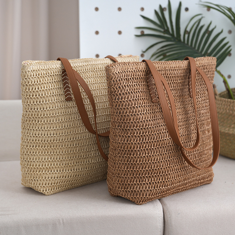 Bolsa de paja estilo de vacaciones bolsa tejida de verano modelo femenino 2025 de gran capacidad para ir al trabajo y a la escuela bolsa de viaje al por mayor