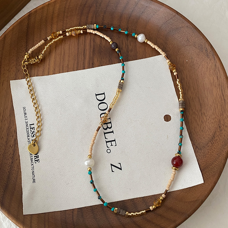 Collar con cuentas de ojo de tigre Maillard Cadena de suéter de otoño e invierno de alta calidad Acero de titanio Cadena de clavícula de piedra natural retro de lujo ligero