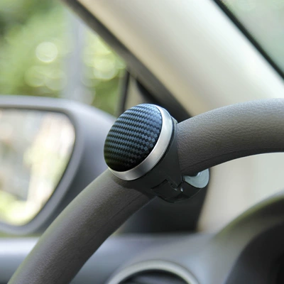 Steering wheel booster ball driving assist artifact