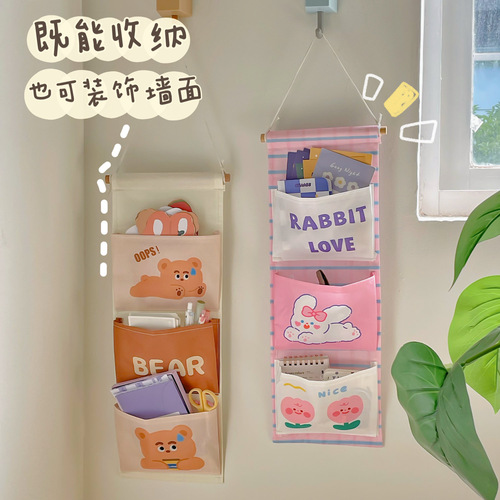 Fabric storage bag hanging behind dormitory door wall-mounted storage bag college student bedside wall hanging mobile phone storage pocket