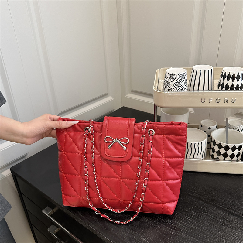 Bolso de hombro de cadena de moda con lazo de gran capacidad para el trabajo para mujer 2025 verano nuevo bolso de nicho