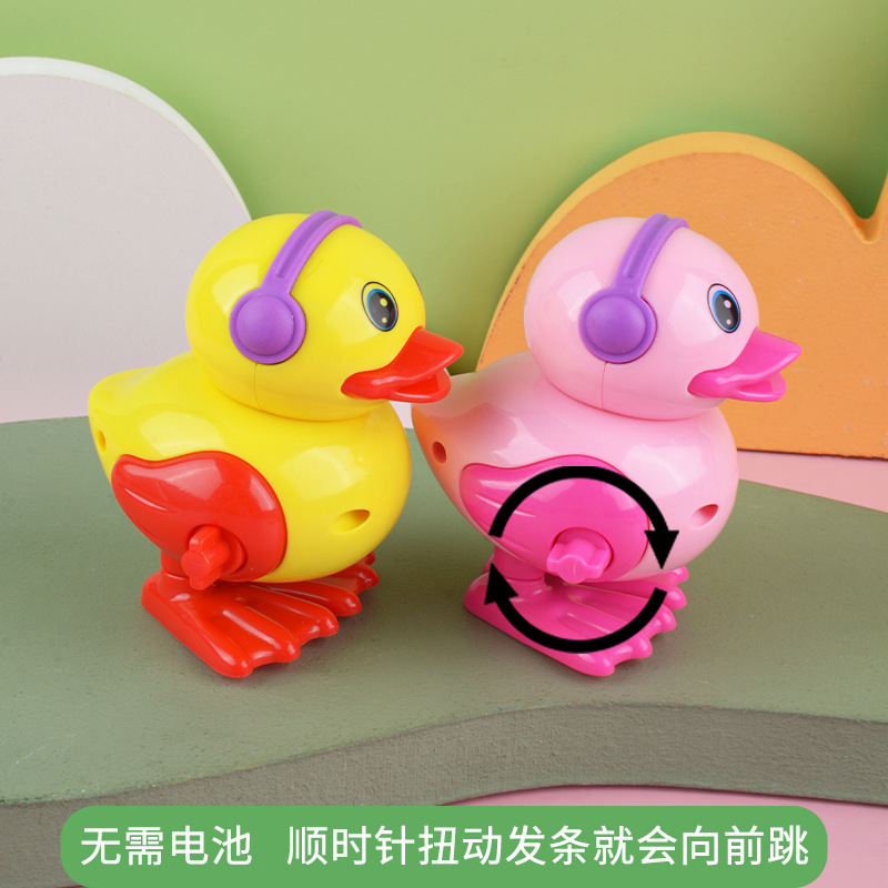 Bobinado pequeño pato reloj pequeño pato puesto buena oferta precio al por mayor pato saltando juguetes para niños al por mayor