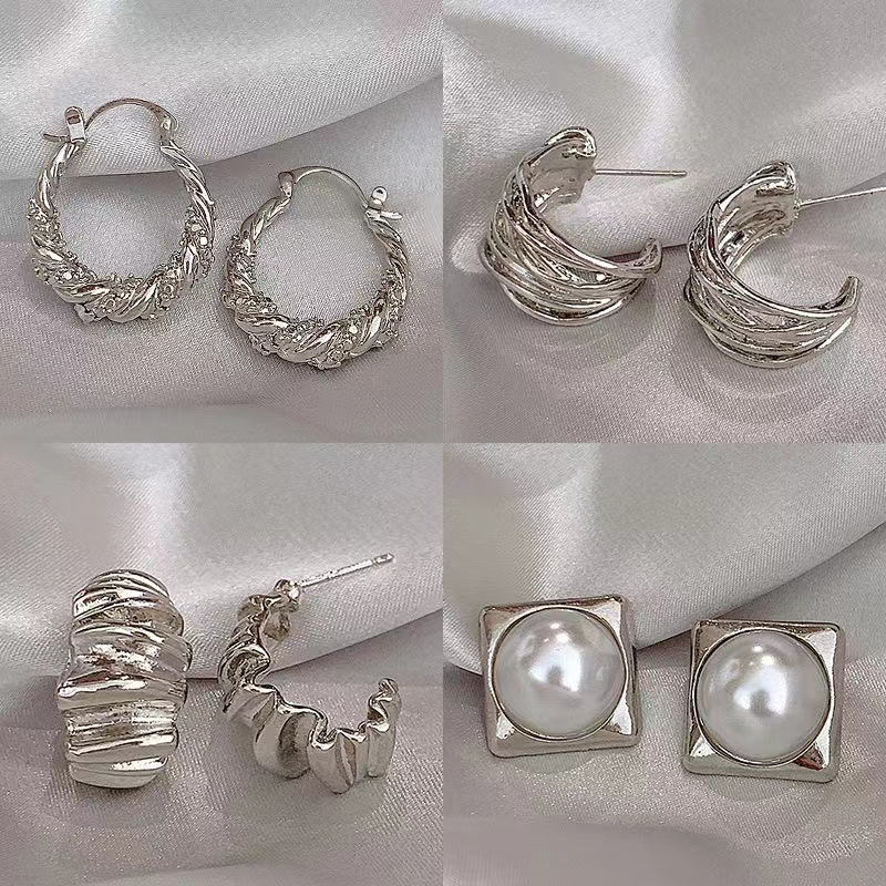 Aguja de plata Zircon en forma de U plisada pendientes curvados personalizada estilo frío serie de plata pendientes simples nichos pendientes de temperamento
