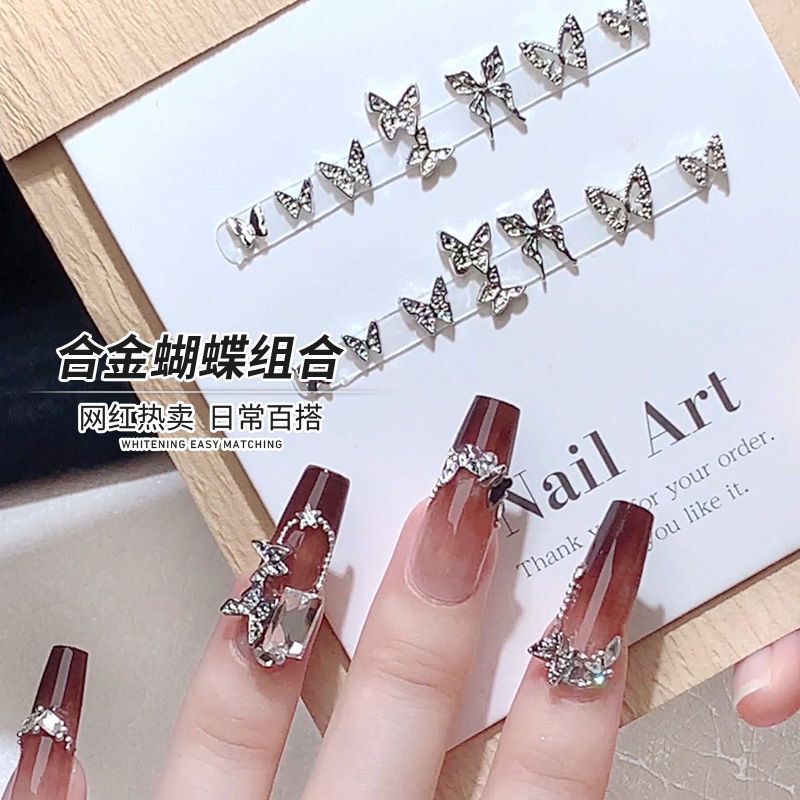 Trendy alloy butterfly nail art decorations, simple hollow silver butterfly, two-section butterfly nail embellishments, 2026 new Trendy alloy butterfly nail art decorations, simple hollow silver butterfly, two-section butterfly nail embellishments, 2026 new