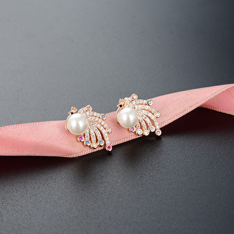 S925 plata esterlina Pavo Real perla pendientes para las mujeres al por mayor diseño de moda sentido nicho temperamento ZIRCON rebordear pendientes