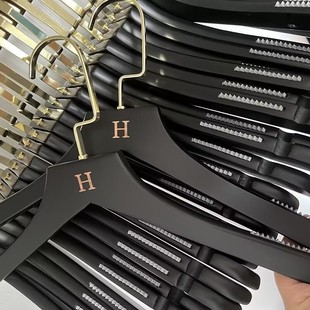LOGO wholesale black solid wood hanger brace adult women's clothing store special non-slip seamless wooden clothes rack
