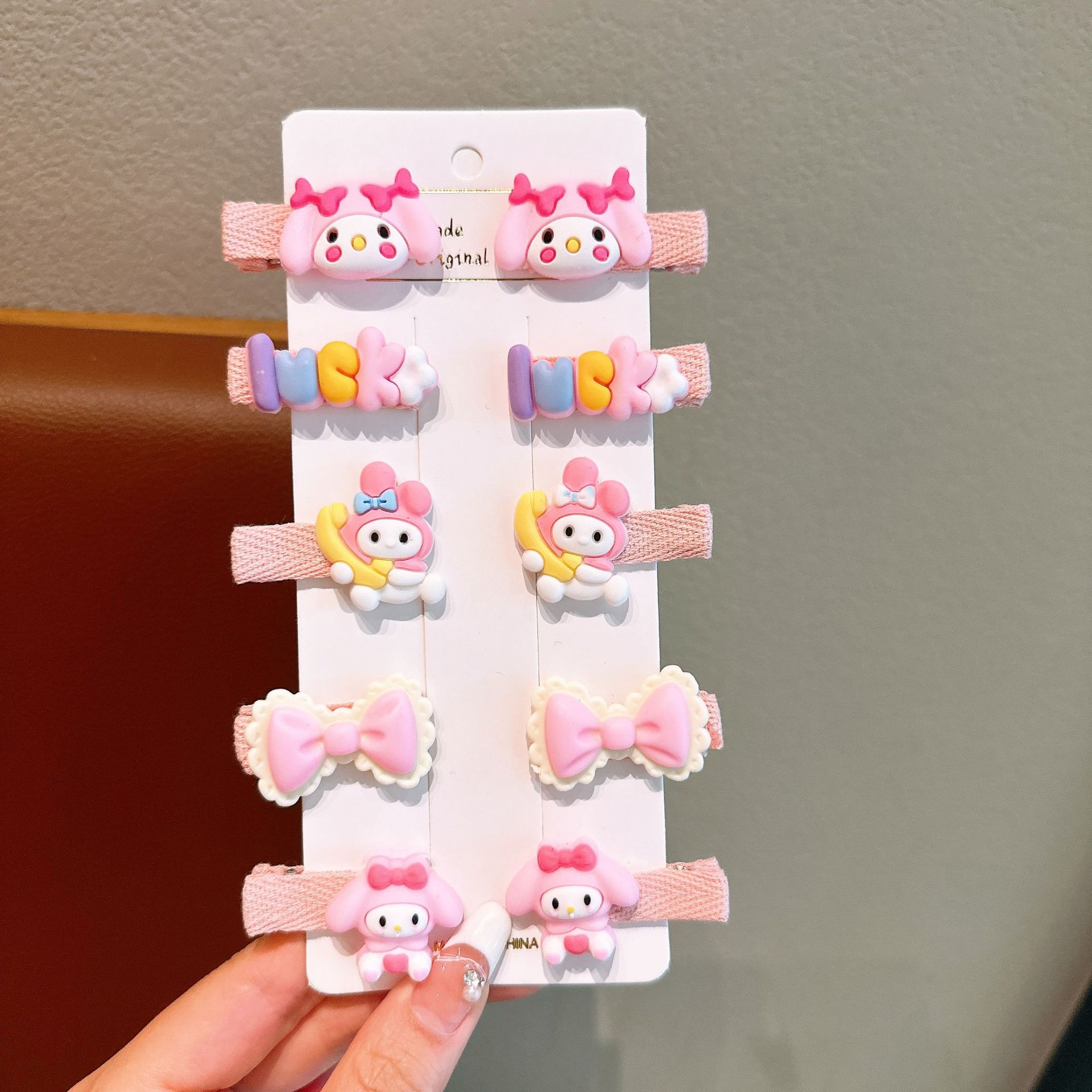 Tombro de bebé femenino Dibujos animados tela todo incluido horquilla para niños 2024 nuevo conjunto de horquillas de gaviota Sanli accesorios para el cabello