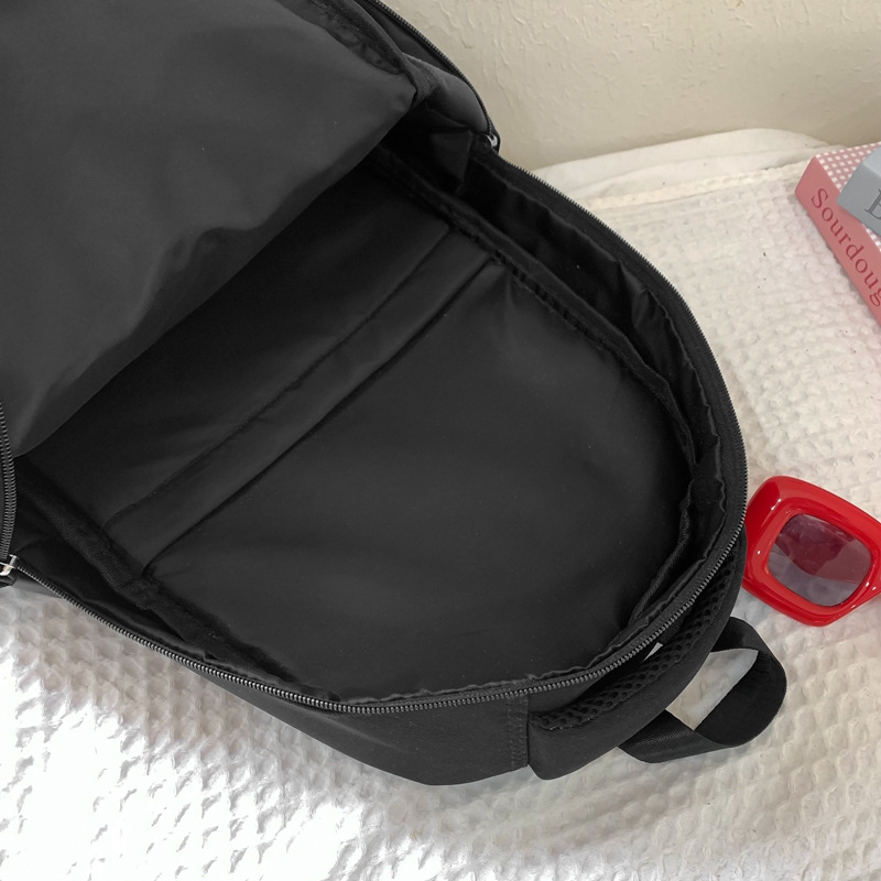 2025 nueva mochila escolar para estudiantes simple ocio estilo campus dibujos animados mochila de gran capacidad versión coreana pequeña mochila fresca