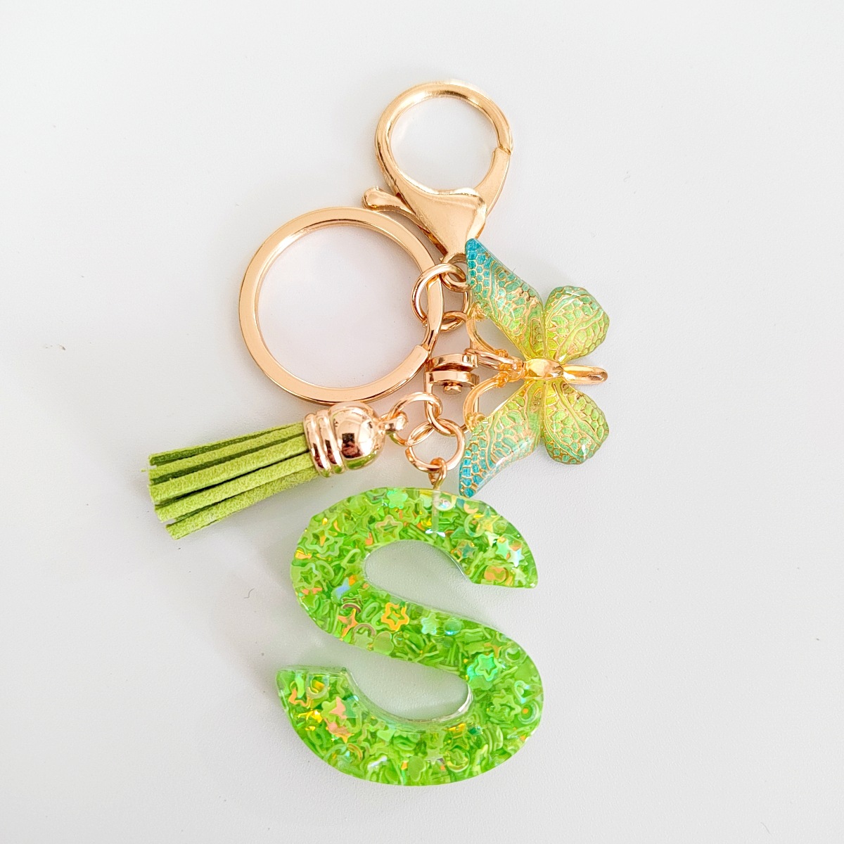 26 letras inglesas llavero colgante estrella verde brillo gota resina colgante llavero de personalidad europea y americana