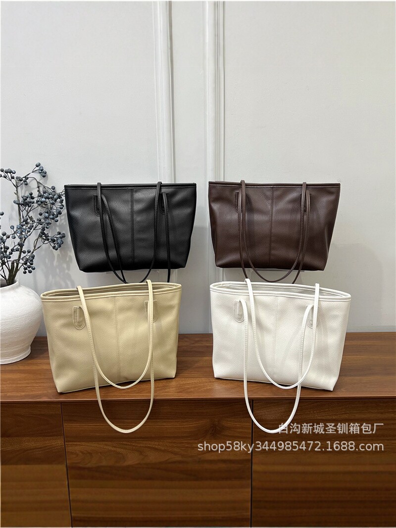 2026 nueva bolsa de gran capacidad de moda de mujer alta textura bolsa de hombro de viaje simple bolsa de mano universal