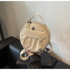 クロスボーダー2025新型ファッション通勤キャンバス円餅バッグ女性大衆デザイン手にしわを持って肩掛けに斜めにまたがる