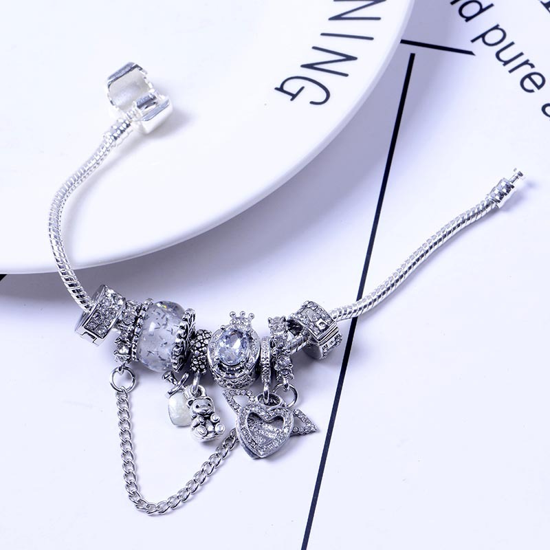 Bracciale donna perle occhio di gatto ali angelo e orsetto_voghion.com