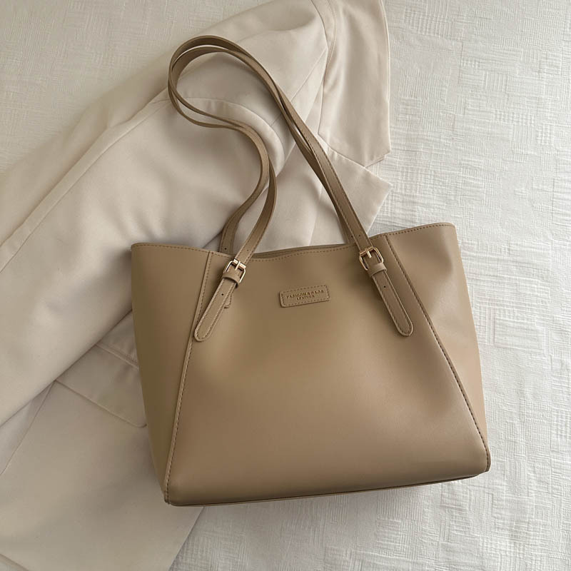 Bolsa de mano de viaje de color sólido bolsa de mano nueva alta alta capacidad axilar otoño y invierno 2024 bolsa de trabajo bolsa de mujer