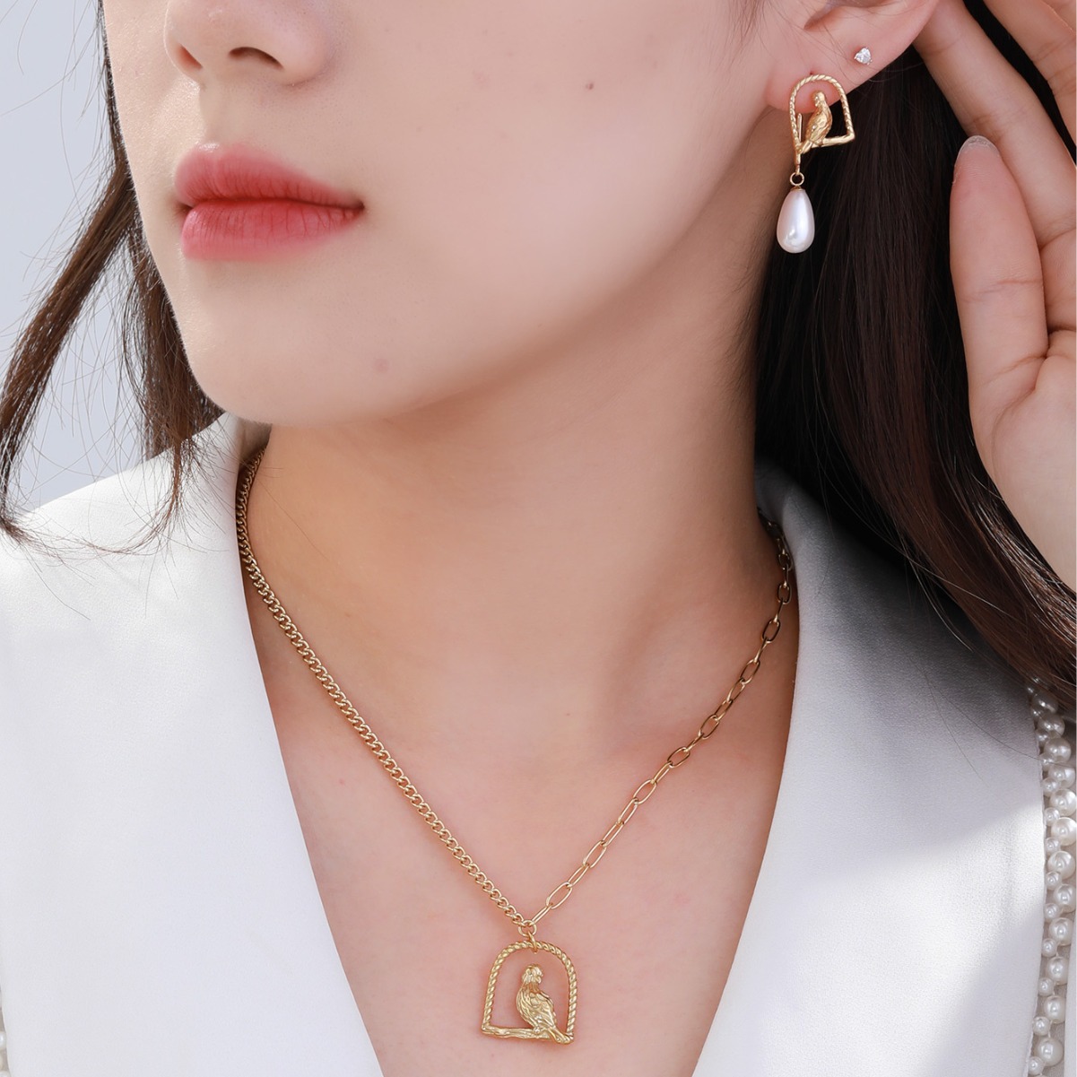 Xuping periquito pájaro jaula de pájaro collar de orejas dos piezas de aretes de moda europea y americana collar de perlas de otoño y invierno conjunto