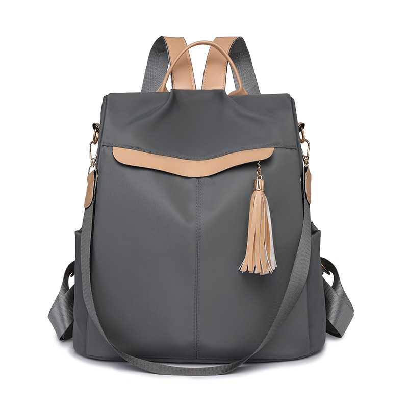 Mochila de nailon ligera casual de moda para mujer nuevo estilo de viaje anti-salpicaduras de agua, resistente al desgaste, antirrobo, mochila de viaje coreana de moda