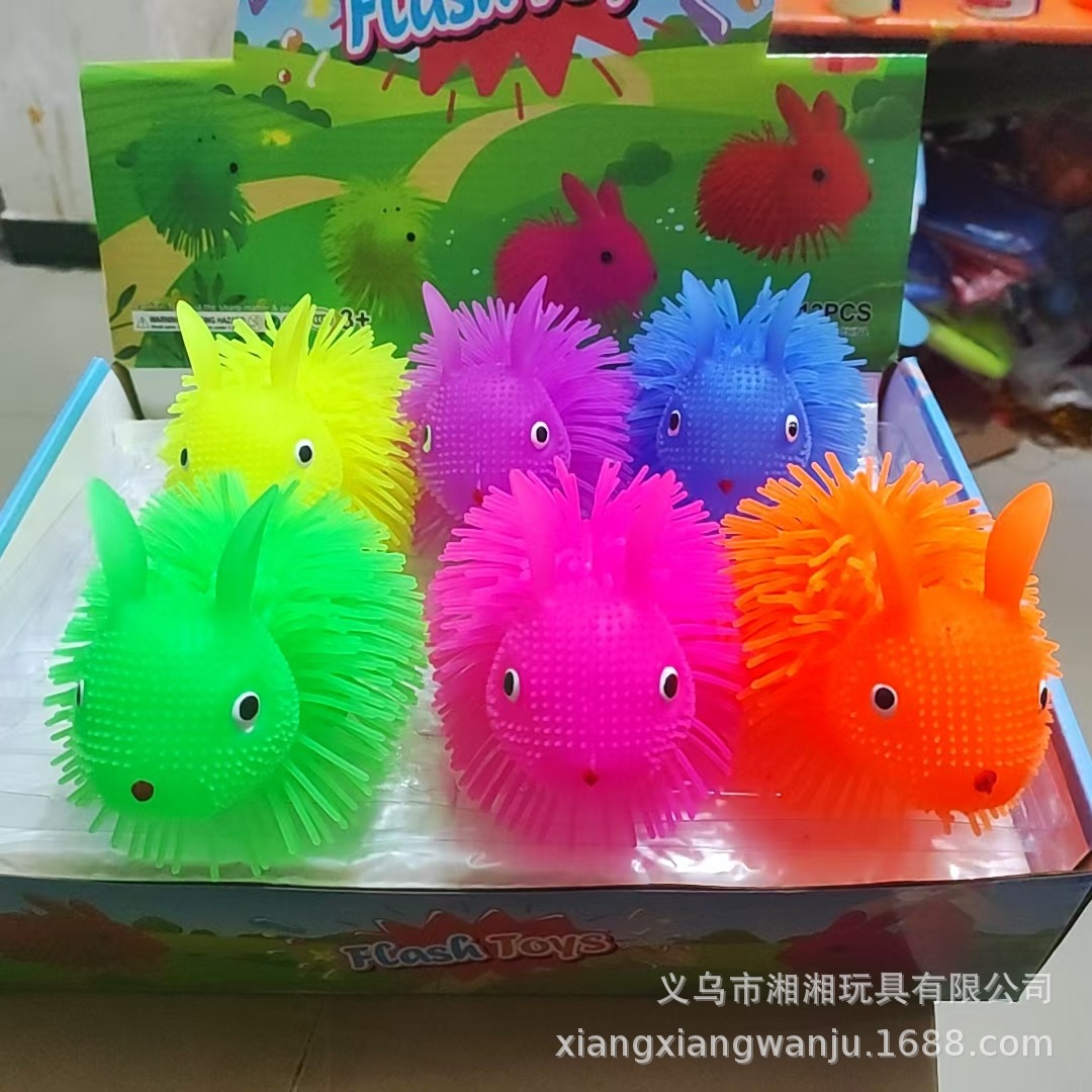 Conejo parpadeante bola de pelo TPR lindos perros peludos brillantes bola de pelo juguetes de ventilación juguetes calientes