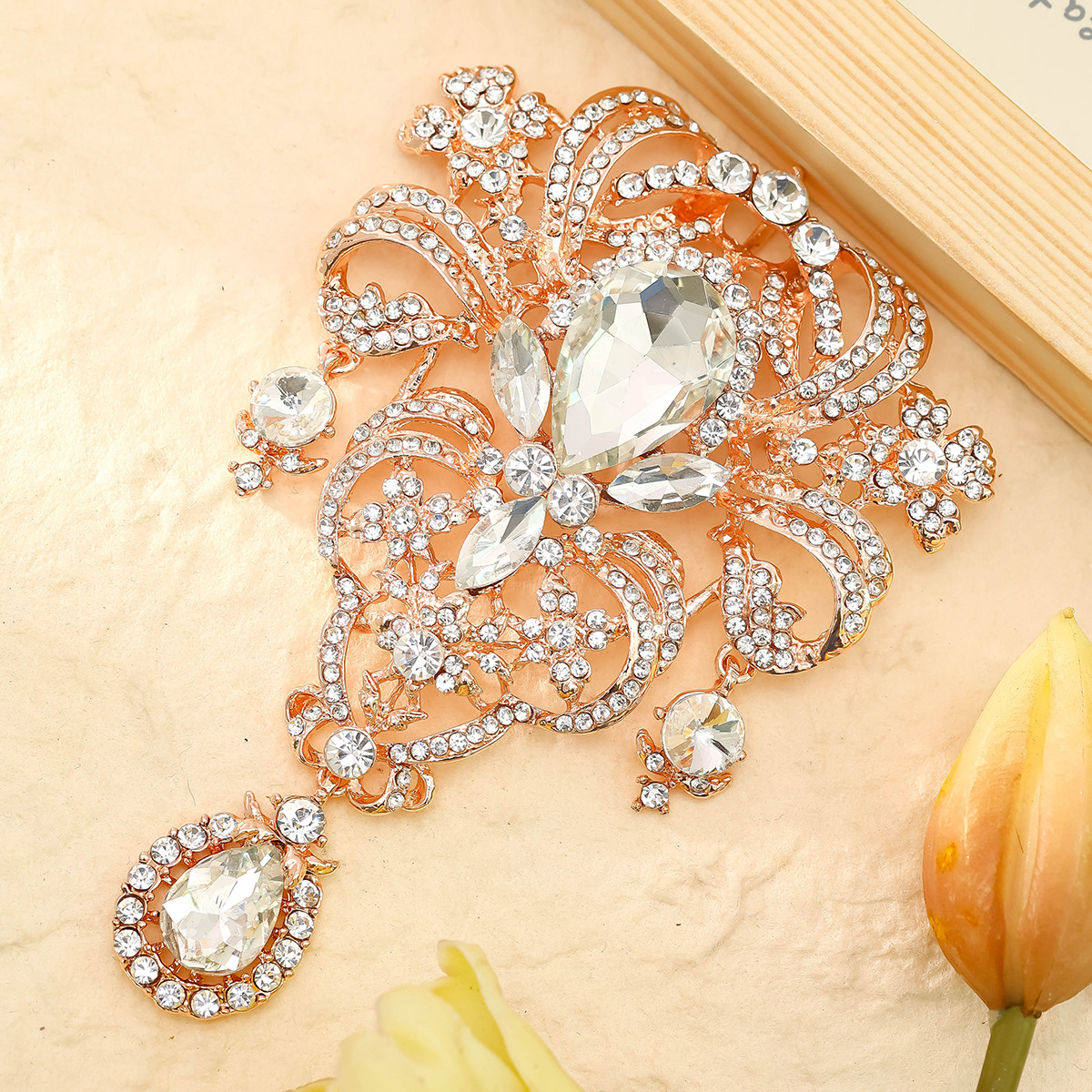 Golden water contains rose, crystal pendant, brooch