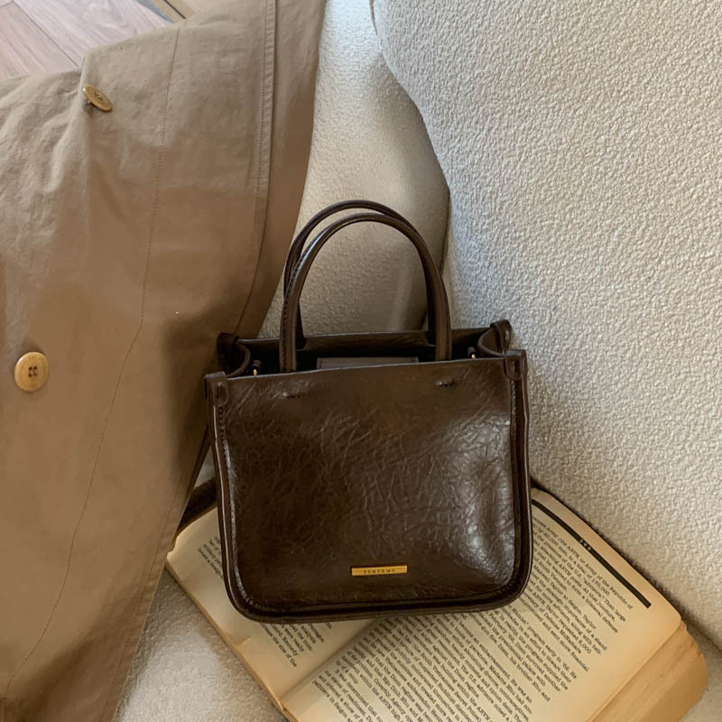 Bolsa de mano retro de alto nivel 2026 nuevo ocio simple bolso cuadrado para viajar bolso universal image 10