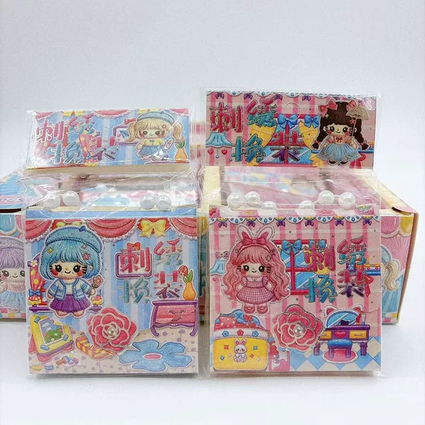Children's toy embroidery dress-up kit with hand-held packaging, featuring cute girl toys, DIY craft stickers, and a sticker book for creating scenes