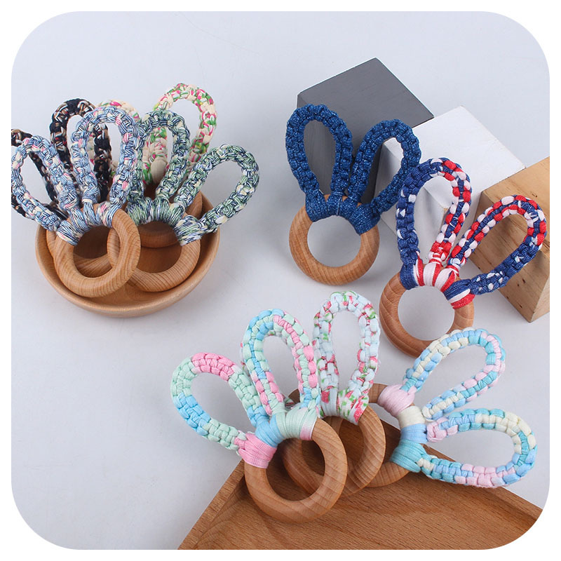 DIY bebé creativo Haya Orejas de conejo mordedor pulsera tejida a mano de algodón cuerda juguete dientes de bebé palo de molienda