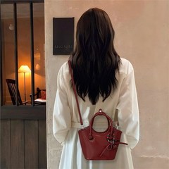アンゴラの赤い野菜のかごのバケツの包みの女性の2025新型の高級感の軽さの小さい大衆の新婦の結婚する斜めのショルダーバッグ