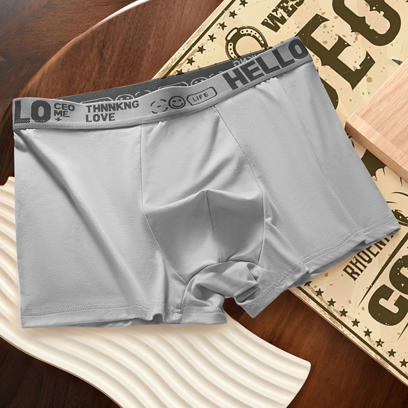 Ropa interior masculina, letras juveniles, cintura media suelta y cómoda, transpirable y sin costuras, pantalones cortos de cuatro esquinas para estudiantes al por mayor