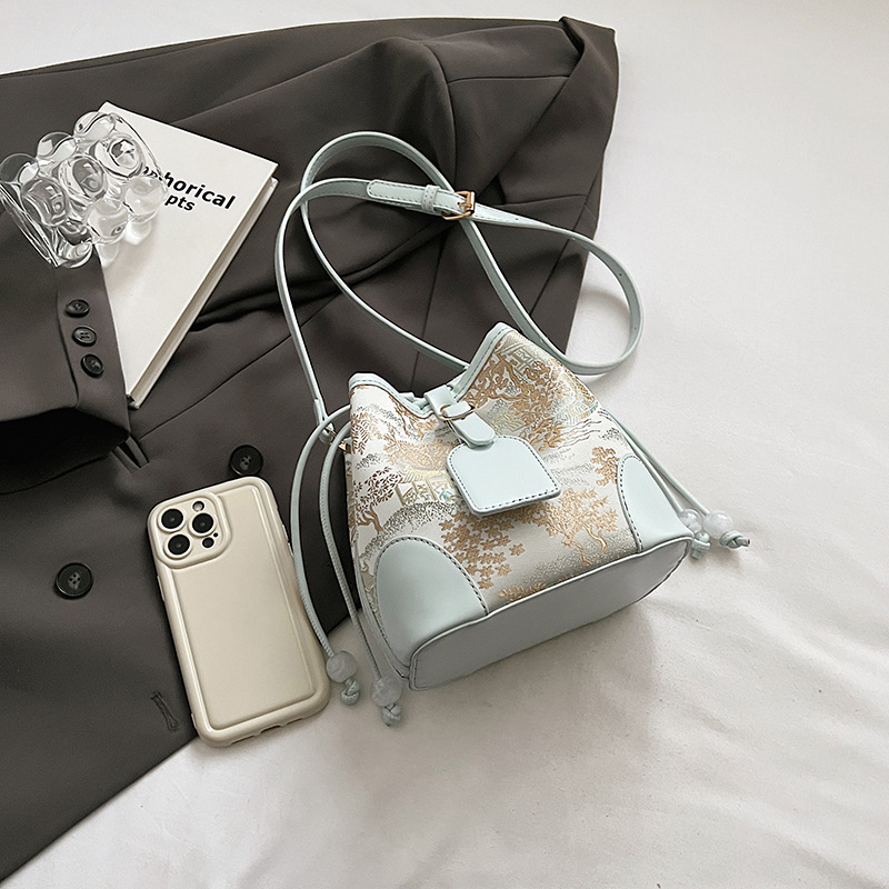 Nationalt nichedesign super populær vestlig bucket-taske, ny kinesisk stil 2024 enkelt skulder crossbody-taske_voghion.com