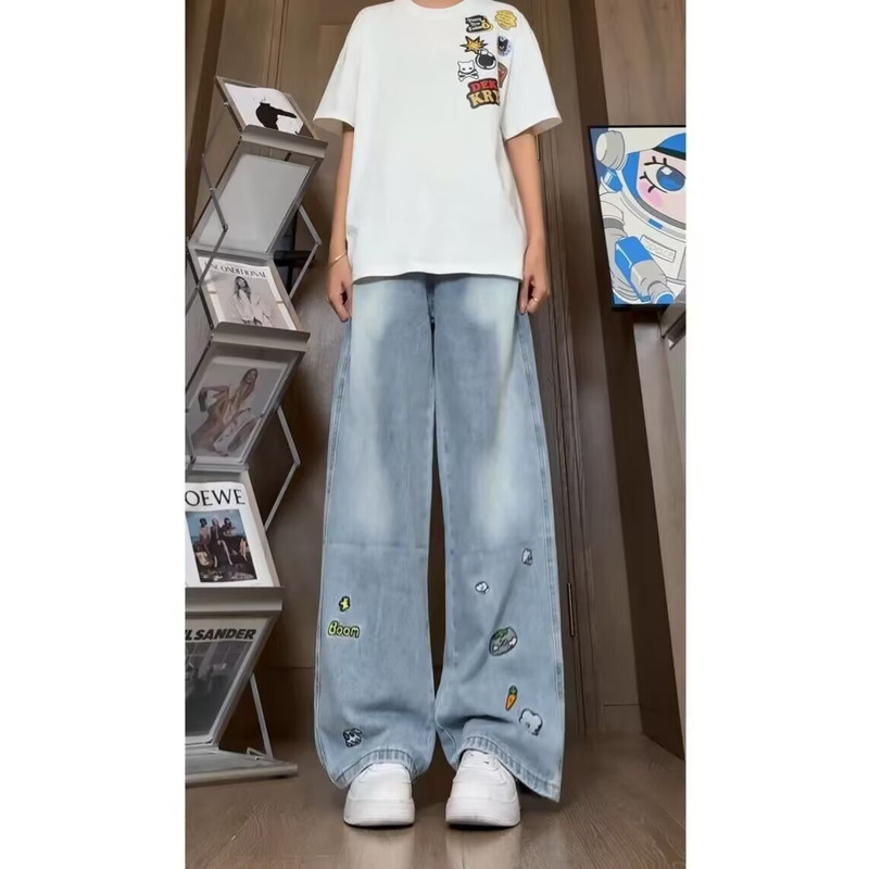 Gradient jeans with scattered cartoon carrots, clouds, and lightning bolts, loose-fitting, drapey, unisex everyday jeans Gradient jeans with scattered cartoon carrots, clouds, and lightning bolts, loose-fitting, drapey, unisex everyday jeans