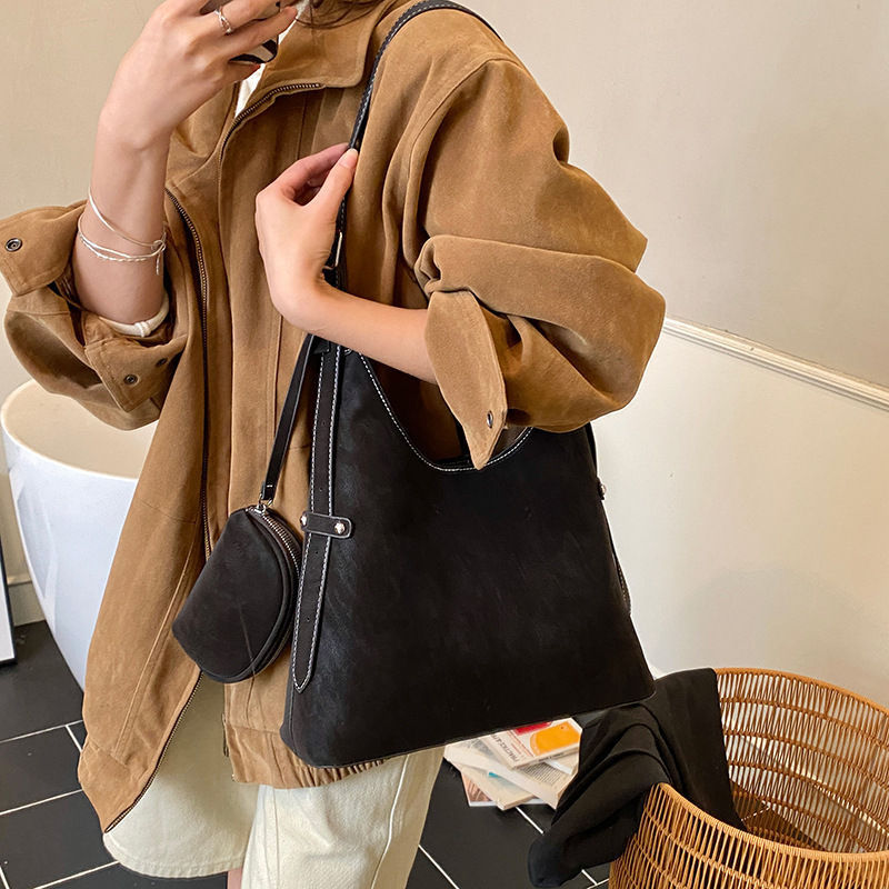 Bolso relajado coreano de cuero suave retrógrado para mujeres bolso de cubo de gran capacidad 2025 nuevo hombro bajo la braza bolso mochila