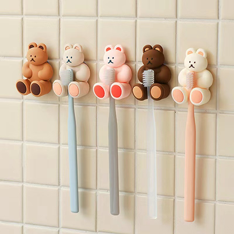 Fabricante lindo tridimensional Oso de silicona ponche-libre montado en la pared titular del cepillo de dientes lindo cuarto de baño ventosa de dibujos animados cepillo de dientes titular