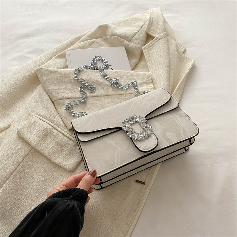 Moda simple temperamento coreano cadena de hombro bolso de mochila para mujeres 2024 primavera nueva bolsa de diamantes de estilo extranjero