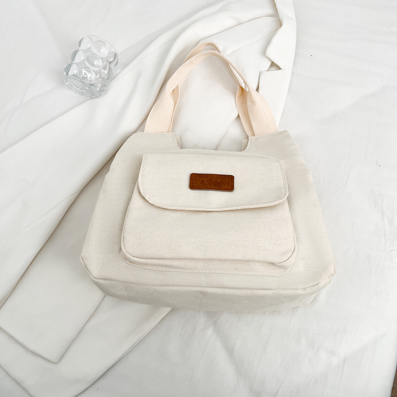 Bolsa de lona de gran capacidad para mujeres otoño-invierno 2024 nuevo estilo tideins viento brazalete bolsa de ocio estudiante bolsa de tote minimalista viento