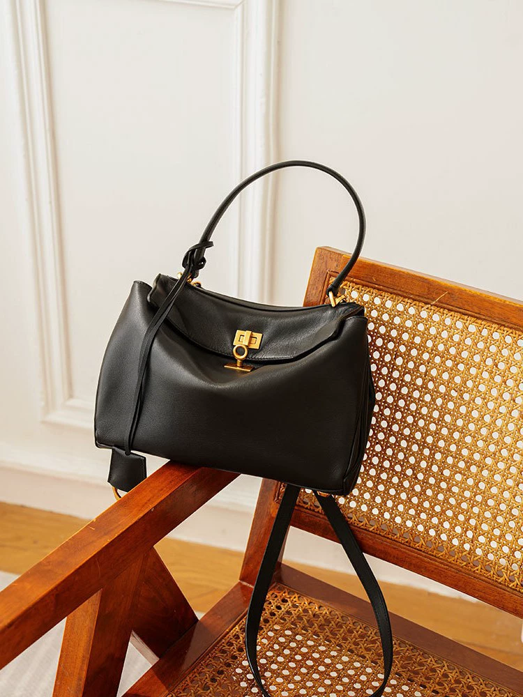 Black capacious one-shoulder bag for men and women